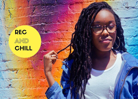 Rec and Chill founder Chelsea Barley in front of a colorful brick wall